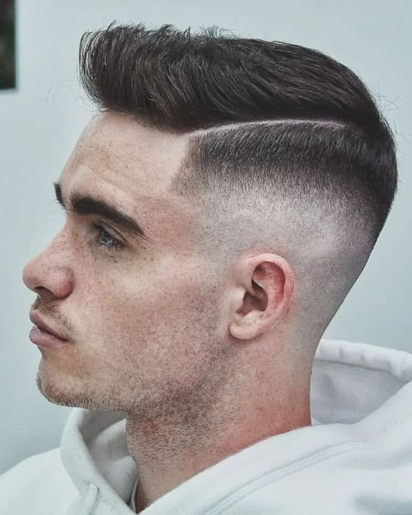 Edgy High Comb Over Fade with Hard Part